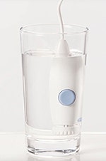 Waterpik handle in glass of water