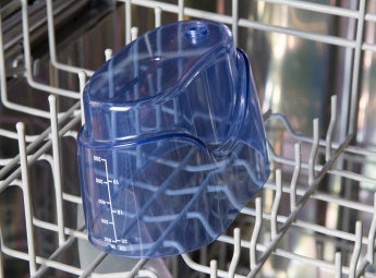 Water flosser reservoir in dishwasher